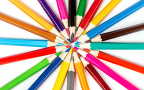 Beautiful sharp multicolored pencils on a white background