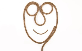 Лицо из веревки на белом фоне