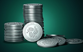 IOTA coins on green background