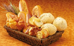 Delicious fresh pastries in a basket on the table