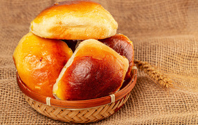 Fresh appetizing buns in a basket