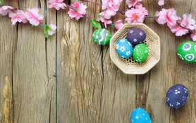 Bright multicolored eggs with pink flowers for Easter