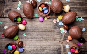 Chocolate eggs with colorful candies for Easter