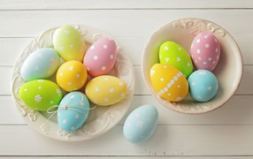 Two plates with colorful Easter eggs