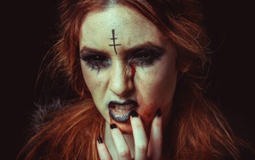 Girl with Halloween makeup on a black background