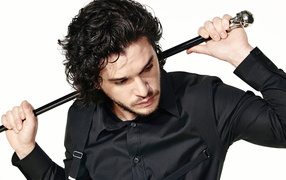 Actor Kit Harington with a cane in his hand