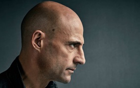 Actor Mark Strong face on gray background