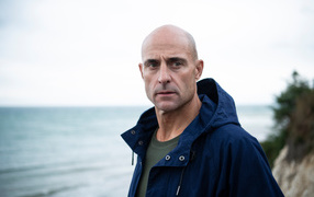 Brutal actor Mark Strong by the sea