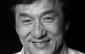 Jackie Chan actor face on black background