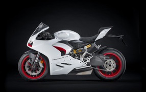 White motorcycle Ducati Panigale v2 on a black background