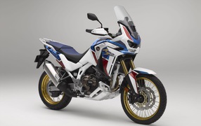 2021 Honda CRF1100L Africa Twin motorcycle against gray background
