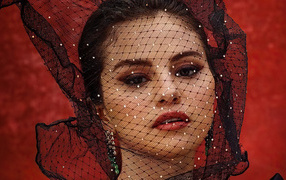 Singer Selena Gomez with a veil on her face