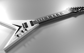 White electric guitar on gray background