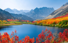 Beautiful autumn landscape of the lake against the background of mountains