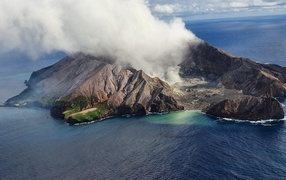 White Island volcanic island in a cloud of white smoke, New Zealand
