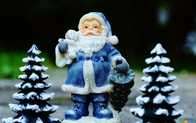 Statuette of Santa Claus and Christmas trees for the new year