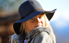 Little blonde girl in hat