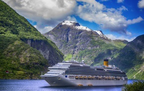 Big white cruise ship in the fjord