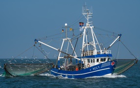 Fishing schooner with nets in the sea
