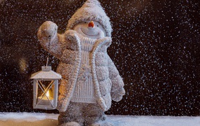 Snowman figurine with lantern