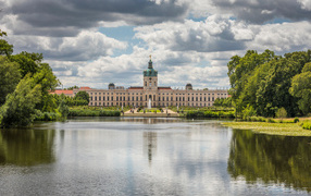 Nice view of Charlottenburg castle by the lake under white clouds