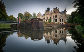 The Efenburg fortress is reflected in the water of the lake, Germany