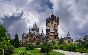 The ancient castle Drachenburg under a stormy sky. Germany