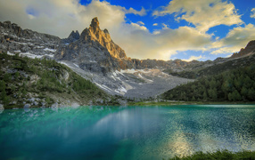 Mountain range Dolomites by the lake, Italy