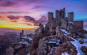 Ruins of the old fortress Kalashio Rocca on the background of a beautiful sky, Italy