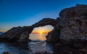 Arch in the rock at sunset, Spain
