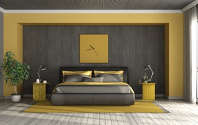 A large black bed stands against a wall with a clock