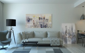 A leather sofa stands against the wall with a painting