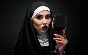 Girl dressed as a nun with a glass in her hand