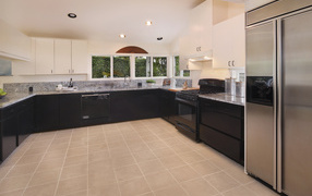 Large kitchen with black furniture