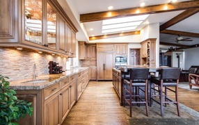 Large kitchen with wooden furniture in the house