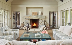 Large living room with upholstered furniture and fireplace