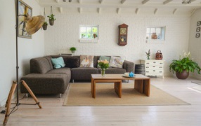 Large sofa in the living room with flowers