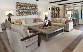 Two sofas and armchairs with a table in the living room