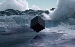 Big black cube over water