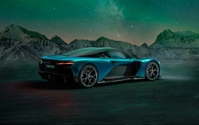 Голубой автомобиль Zenvo Aurora Agil  вид сзади на фоне гор