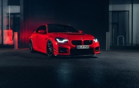 Красный автомобиль AC Schnitzer ACS2 Sport 2023 года