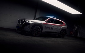 2024 BMW XM Label Red MotoGP Safety Car SUV in building