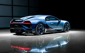 Car Bugatti Chiron rear view is reflected in the surface