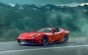 Красный спортивный автомобиль Ferrari 812 GTS N-Largo в горах