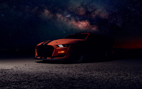 Beautiful car Ford Shelby GT500 against the background of the night sky