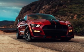 Red Ford Mustang Shelby GT500 in the mountains