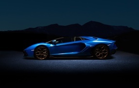 Blue Lamborghini Aventador car at night
