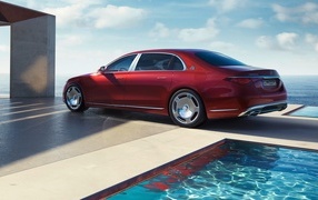 Red 2023 Mercedes-Maybach S-Class S 580 E by the pool