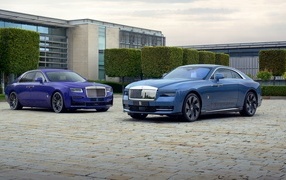 Two stylish expensive cars Rolls-Royce Specter and Rolls-Royce Ghost