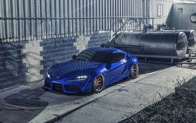 Blue sports car Toyota Supra Luxury at the building